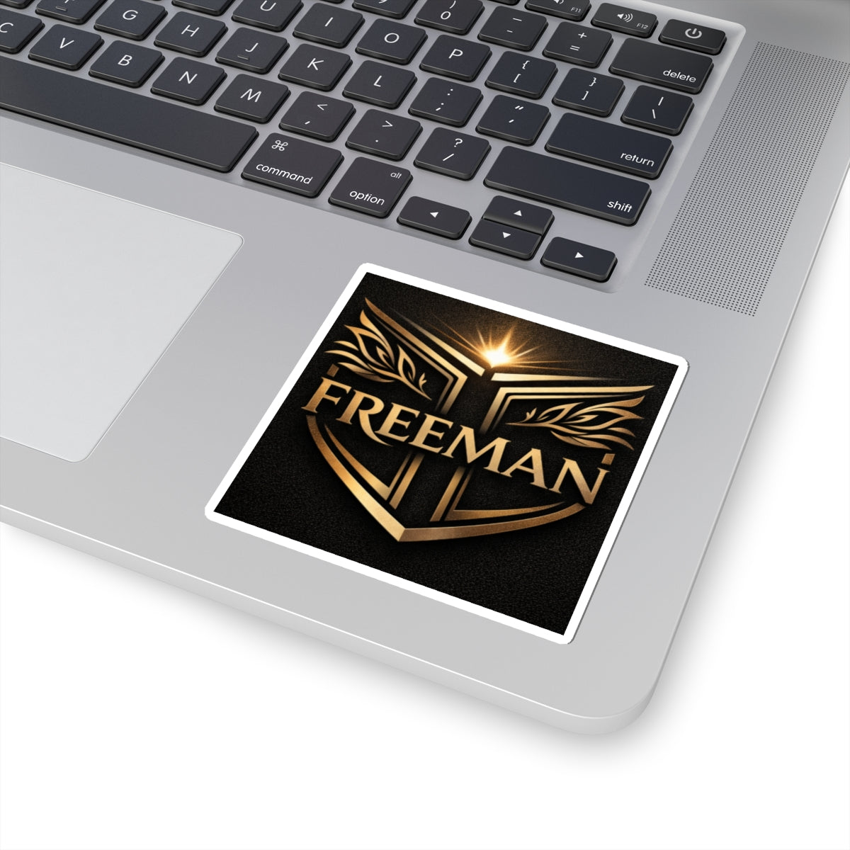 Freeman Gold Crest Sticker — Metallic Shield Kiss-Cut Laptop Decal